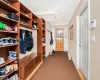 Mudroom with carpet and crown molding