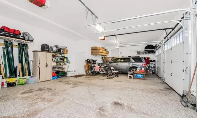 Heated 3 car garage with a garage door opener