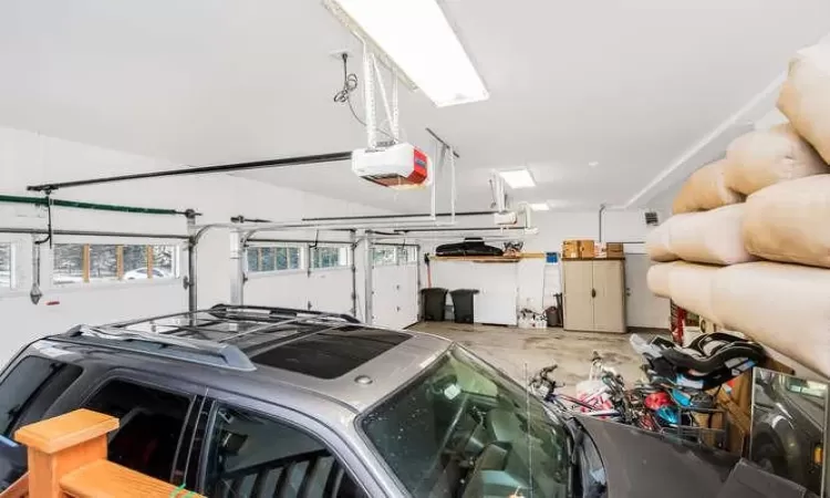 Heated 3 car garage with a garage door opener