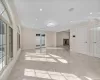 Unfurnished living room featuring a fireplace, plenty of natural light, and ornamental molding