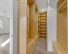 Spacious closet featuring light hardwood / wood-style flooring