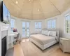 Bedroom featuring access to outside, french doors, wood ceiling, and light wood-type flooring