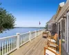 Wooden terrace featuring a water view