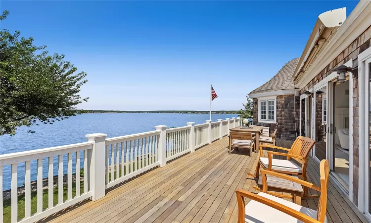 Wooden terrace featuring a water view