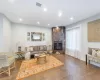 Living room featuring dark hardwood / wood-style flooring and a fireplace