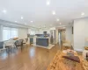 Living room with sink and light hardwood / wood-style floors