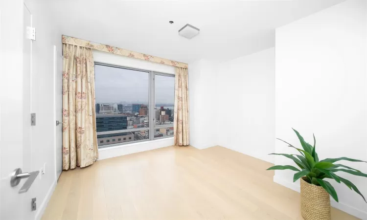 Spare room featuring hardwood / wood-style flooring