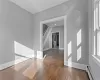 Spare room featuring baseboard heating and dark hardwood / wood-style flooring