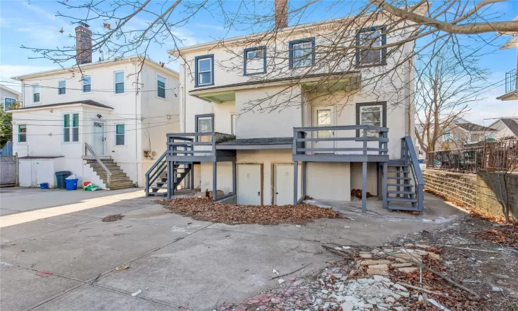 Rear view of house with a wooden deck