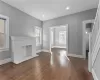 Unfurnished living room featuring a fireplace and dark wood-type flooring