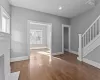 Unfurnished living room featuring wood-type flooring and a fireplace