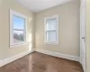 Unfurnished room with dark hardwood / wood-style floors