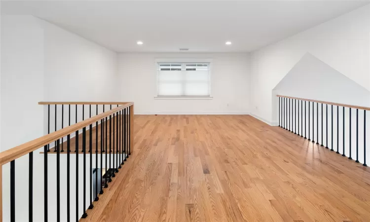 Hall featuring light wood-type flooring