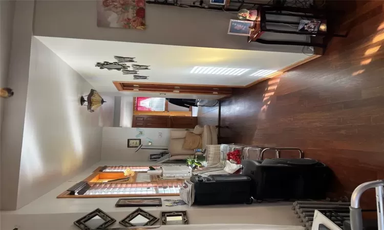 Kitchen with dark stone countertops, decorative backsplash, refrigerator, and range