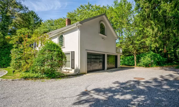 View of property exterior with a garage