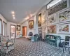 Living room featuring carpet floors, vaulted ceiling