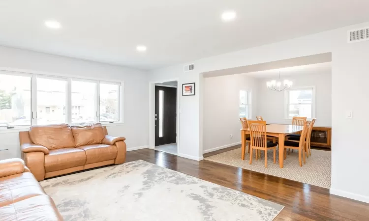 Living room featuring dark wood flooring