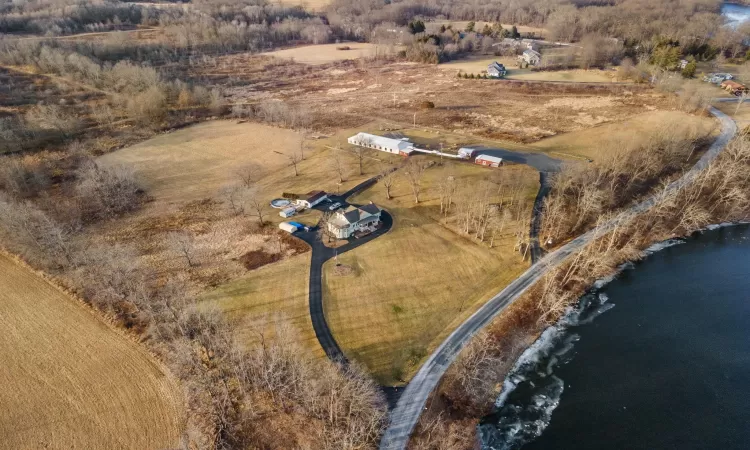 Drone / aerial view featuring a water view and a rural view