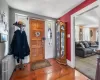 Carpeted entryway with a textured ceiling and radiator