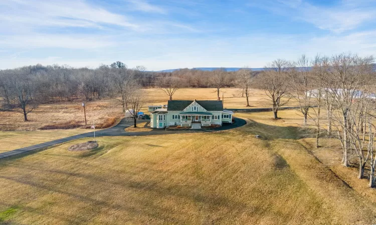 Birds eye view of property featuring a rural view