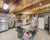 Kitchen with double oven range, high end range, light hardwood / wood-style floors, and white refrigerator