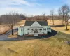 View of front of house featuring a front yard and a porch