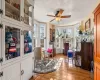 Sitting room featuring a textured ceiling, light hardwood / wood-style flooring, and ceiling fan