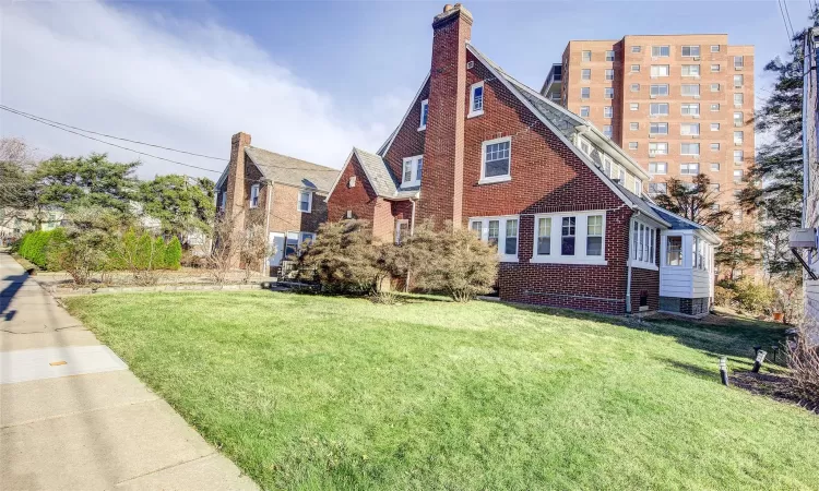 View of front of property with a front lawn