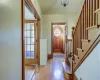 Foyer with a healthy amount of sunlight and light wood-type flooring