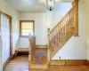 Foyer entrance with hardwood / wood-style flooring and a notable chandelier