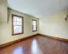 Unfurnished room featuring dark hardwood / wood-style flooring