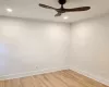 Unfurnished room with wood-type flooring and ceiling fan