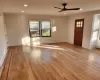 Foyer entrance with ceiling fan and light hardwood / wood-style flooring