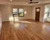 Foyer entrance with baseboard heating, ceiling fan, and light hardwood / wood-style flooring