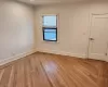 Spare room featuring light wood-type flooring