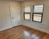 Spare room featuring hardwood / wood-style flooring and a wealth of natural light