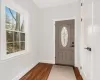 Foyer entrance featuring dark hardwood / wood-style floors