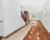 Hall with hardwood / wood-style flooring