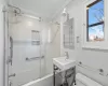 Bathroom featuring shower / bath combination with glass door, toilet, and ornamental molding