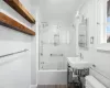 Full bathroom featuring sink, toilet, crown molding, and enclosed tub / shower combo