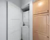 Clothes washing area with stacked washer / dryer