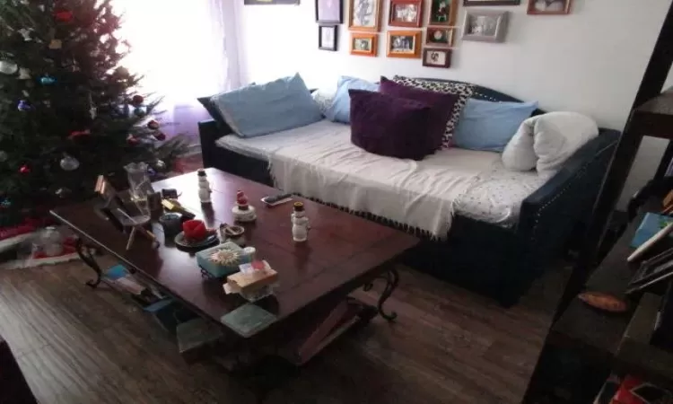 Living room with hardwood / wood-style floors