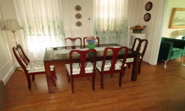 Dining room with wood-type flooring