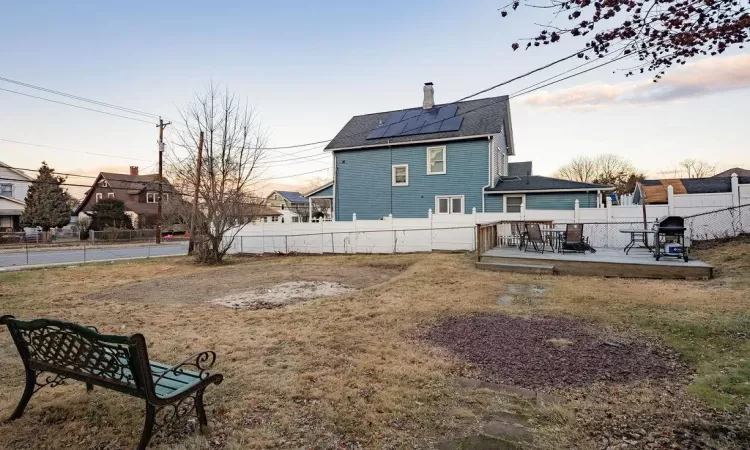 Yard at dusk with a patio area