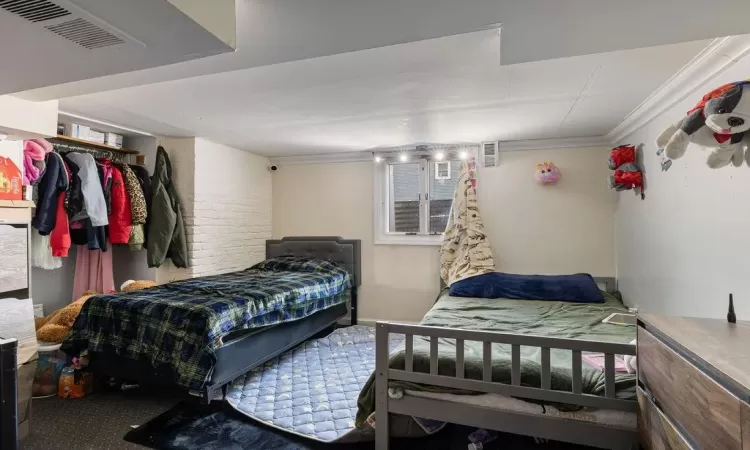 Bedroom with ornamental molding