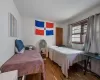 Bedroom featuring wood-type flooring