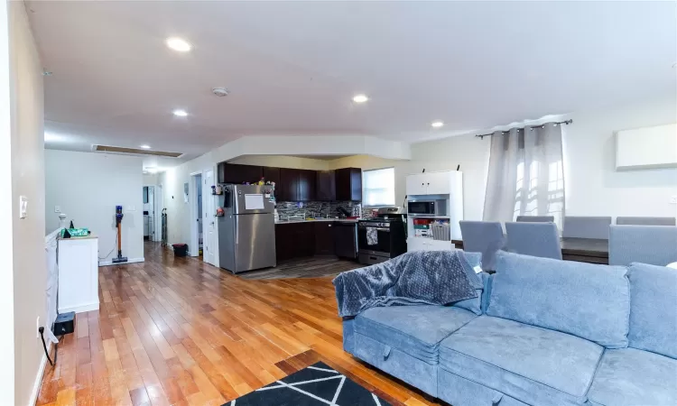 Living room with light wood-type flooring