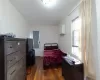 Bedroom featuring dark hardwood / wood-style flooring