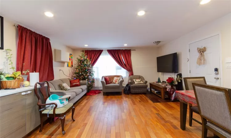 Living room with light wood-type flooring