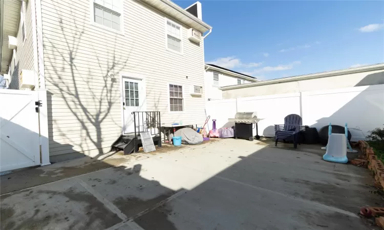 Rear view of house featuring a patio